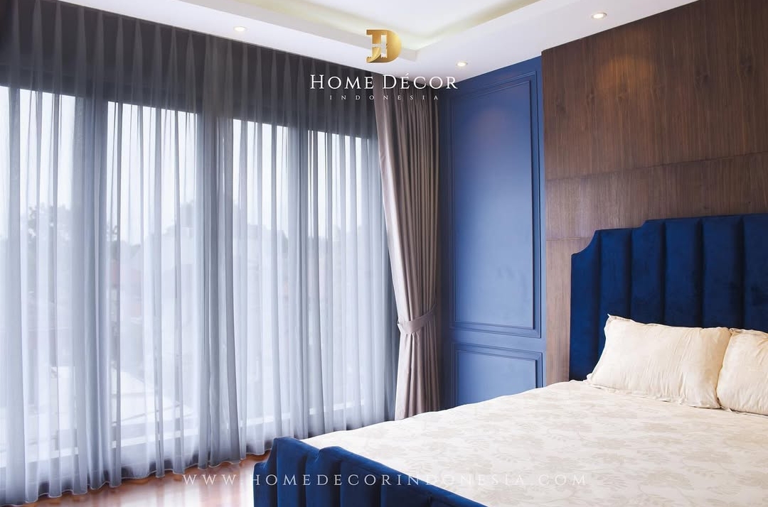 Luxurious bedroom with layered grey sheer and beige blackout curtains, showcasing expert curtain service and stylish window treatments.