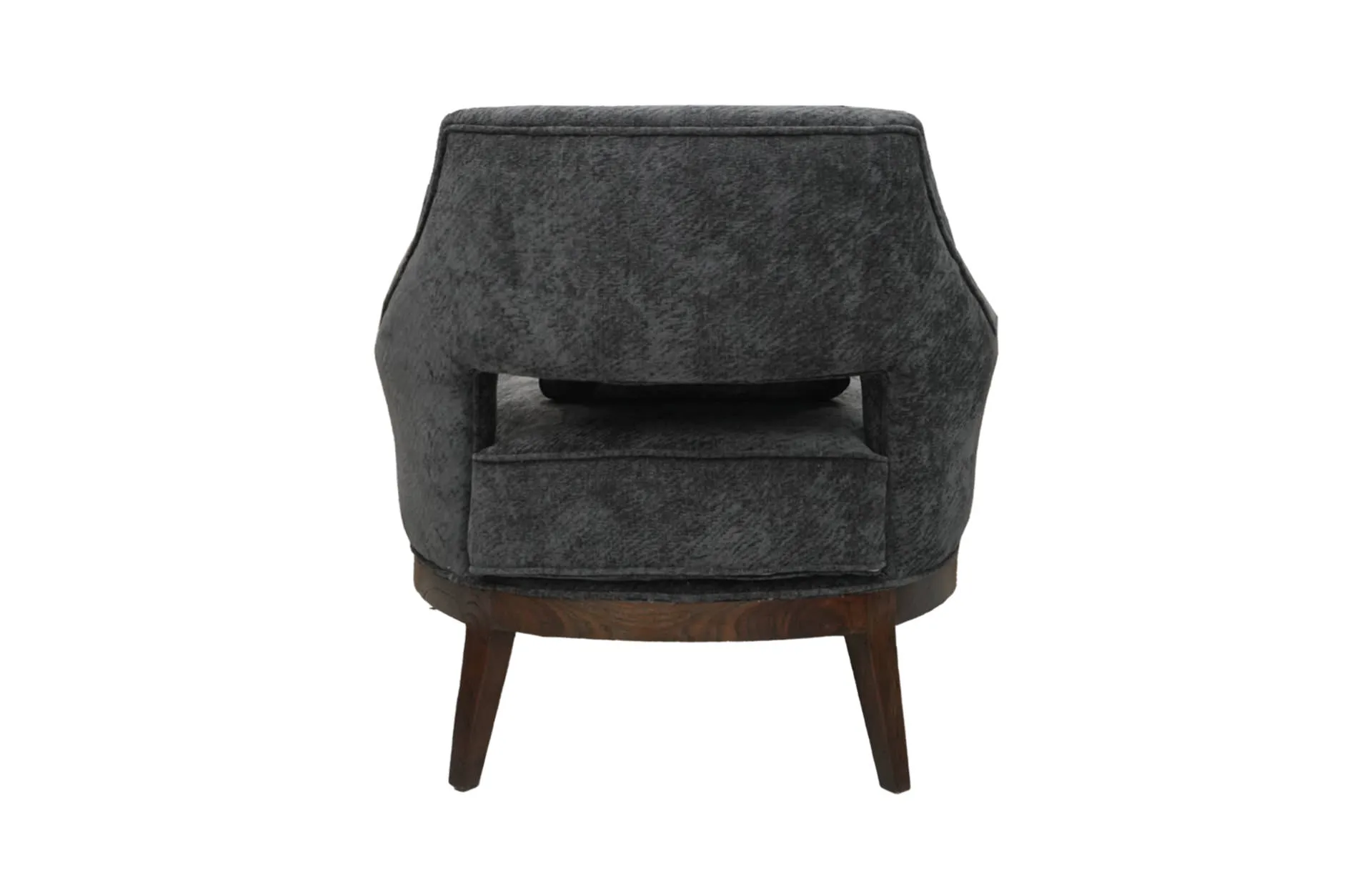 A side view of the Livia Armchair, highlighting its gracefully curved backrest, plush seat cushion, and the elegant angle of its supportive legs, showcasing its sophisticated silhouette and modern design.