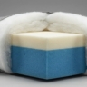 A high-quality "Cutaway" or cross-section shot of a luxury sofa cushion.