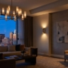 A perfectly lit, high-end living room during "blue hour" (dusk).