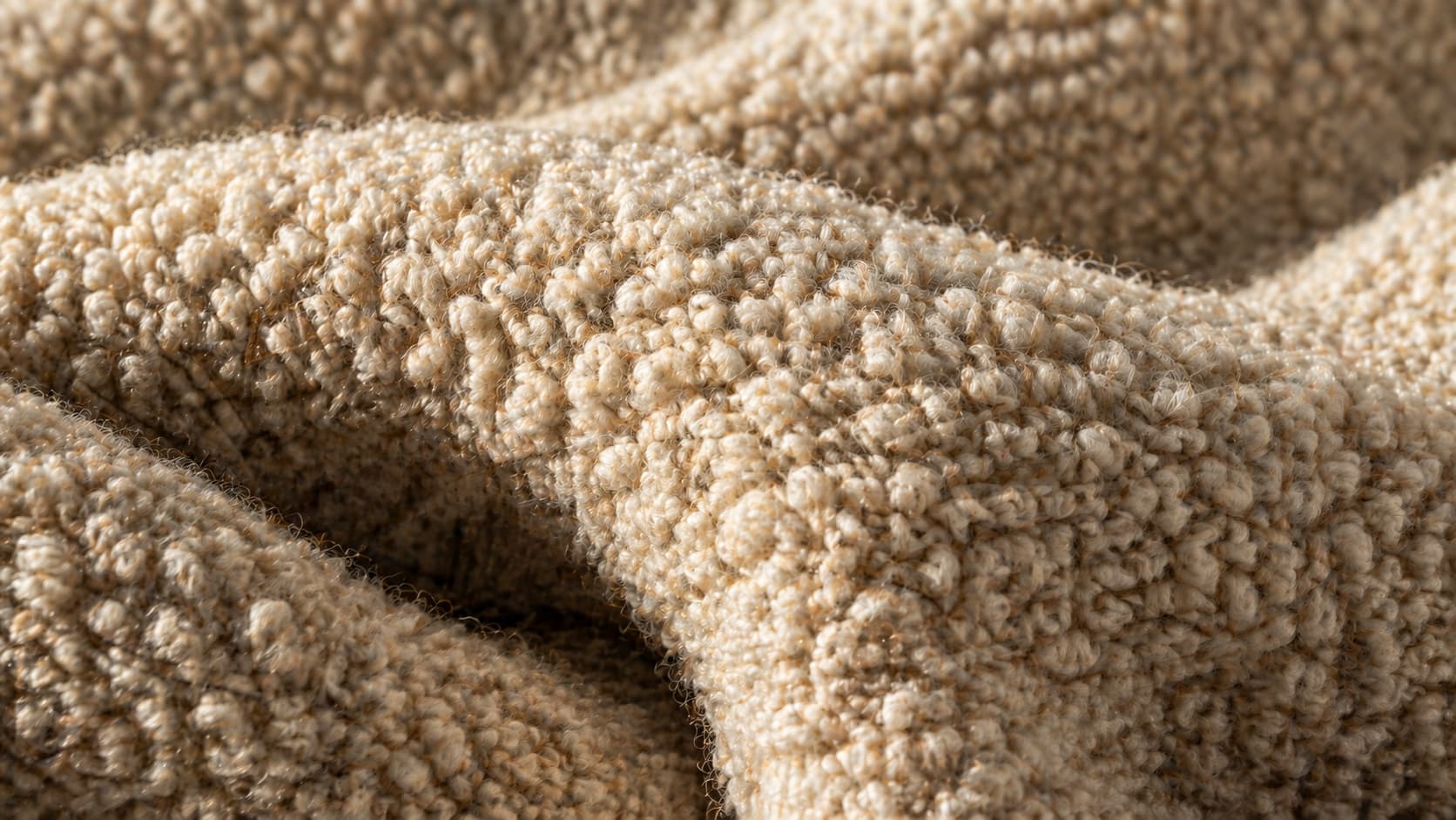 An extreme close-up macro photograph of the bouclé fabric.